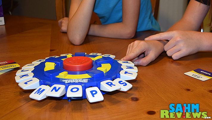 Tapple by USAopoly is a fast-paced word game suited for all ages. With categories for adults and kids, it is sure to keep everyone entertained during your next family game night! - SahmReviews.com