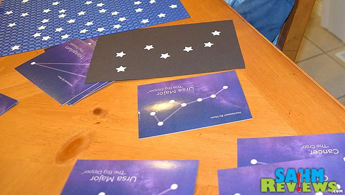 Using sample cards, a star punch and some paper, a child can learn about constellations. - SahmReviews.com