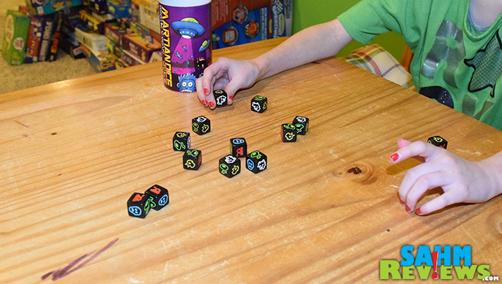 Available for under $8 on Amazon, Martian Dice by Tasty Minstrel Games is a perfect time-killer for all ages. And you get to abduct people! - SahmReviews.com