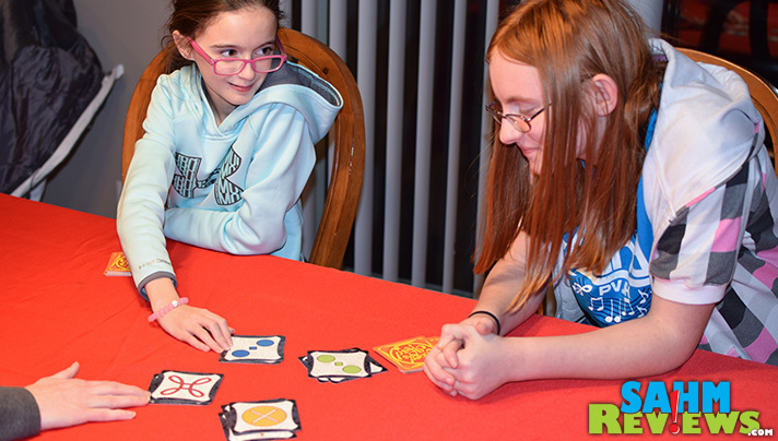 Supporting up to 10 players, Asmodee's Jungle Speed will test both your matching ability as well as your reaction time! - SahmReviews.com