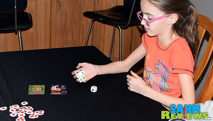 Bang! The Dice Game: The Walking Dead pits survivors and loners against the saviors in a head-to-head battle to the end! Hope you roll lucky! - SahmReviews.com