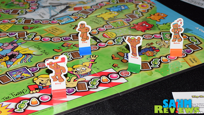 Take revenge on that classic gumdrop game, Candyland, by biting the head and arms of your opponent in Run For Your Life, Candyman! by Smirk & Dagger Games! - SahmReviews.com