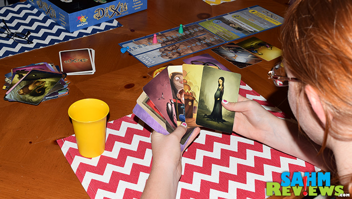 Dixit Journey was one we had played with friends, now we found a copy at a local thrift store! It's in the top 300 on BGG too! - SahmReviews.com