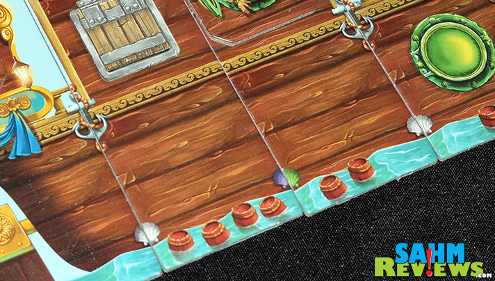 Stronghold Games' Piratoons has a unique mechanic for revealing the contents of the pirate's chest. It flips over without spilling any of the booty! - SahmReviews.com