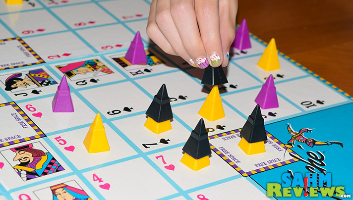 Touché is a mix of Sequence and Tic-Tac-Toe. Find out why we were excited to add this abstract game by Cadaco to our collection! - SahmReviews.com