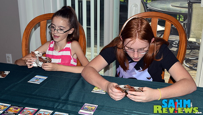 Saturday morning cartoons were a treat in the 70's, now there's on 24-7. Crossover Crisis by Cryptozoic Entertainment brings today's cartoons home! - SahmReviews.com