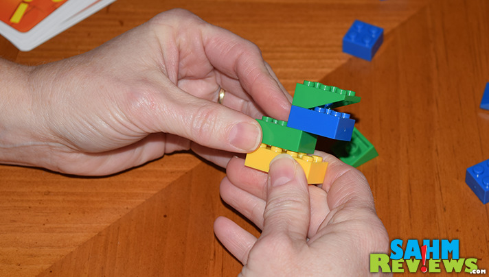 Take classic tangrams and combine it with your old Legos and you get this new game by Renegade Game Studios. See if you can build faster in Brick Party! - SahmReviews.com