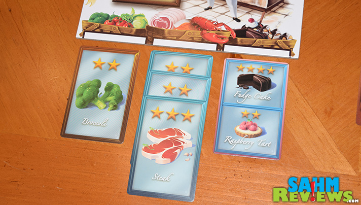In Calliope Games' Titan series board game, Menu Masters, up to five chefs purchase ingredients in an effort to craft the best menu for their restaurant. - SahmReviews.com