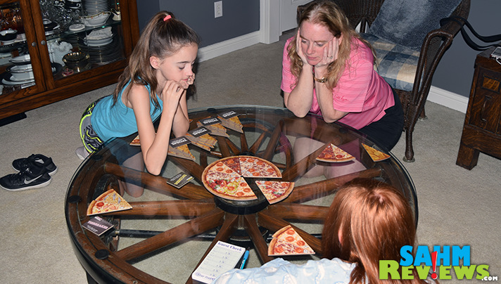 Don't let the pizza box container fool you, this is no ordinary slice of a game. New York Slice by Bezier Games might be perfect for when you have munchies! - SahmReviews.com