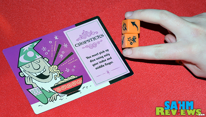 In Ta-Da! dice game from Cool Mini or Not, Feat Cards give players additional challenges to overcome. - SahmReviews.com