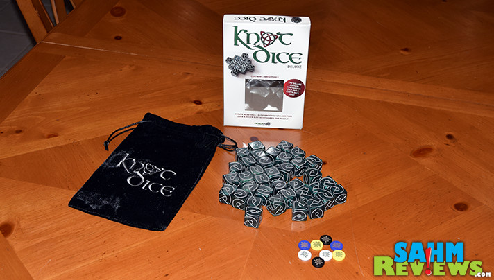 Most games we buy have only one game in the box. Knot Dice by Black Oak Games not only comes with twelve, it has over a half dozen puzzles to solve! - SahmReviews.com
