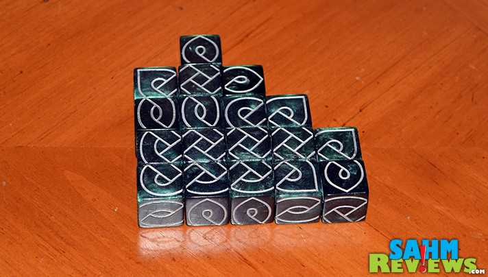 Most games we buy have only one game in the box. Knot Dice by Black Oak Games not only comes with twelve, it has over a half dozen puzzles to solve! - SahmReviews.com