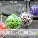We've now amassed a sizable dice collection, but didn't have a way to display them. These lab flasks we found at Michael's turned out perfectly! - SahmReviews.com