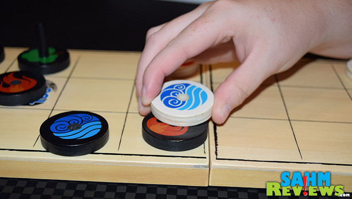 Pulling from the natural elements of fire, water and wood, Elementos by Tyto Games is a 2-player battle to get your wand to the other side of the board! - SahmReviews.com