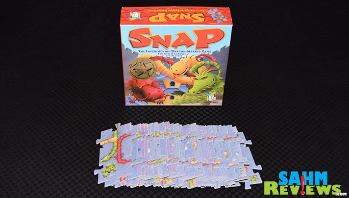 Building dragons should be a course we all take! Snap by Gamewright Games rewards us for the biggest and baddest in this puzzle-like game! - SahmReviews.com