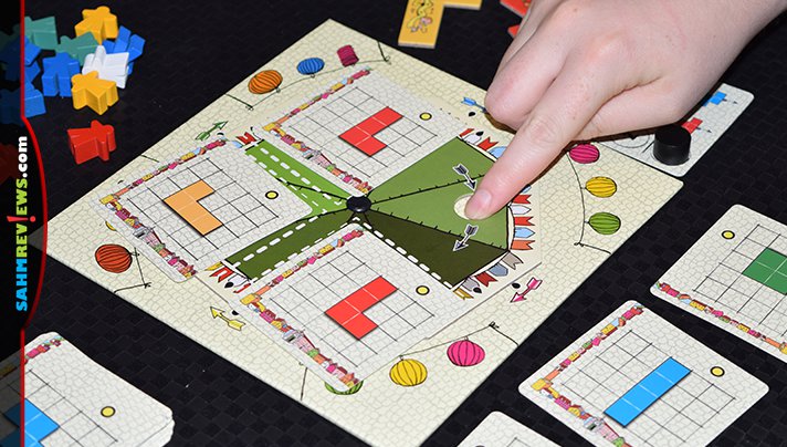 You'll use recognizable polyomino (Tetris-shaped) pieces to entice visitors to your festival in Arraial from Pandasaurus Games. - SahmReviews.com