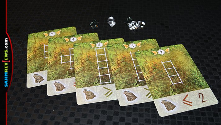 Ever wonder how butterflies decide which flowers to land on? You can make the decision for them in Dust in the Wings by Board & Dice! - SahmReviews.com