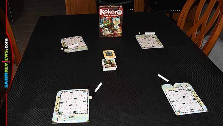 Success lies in the ability to build paths to the Kodama sanctuaries in Kokoro flip and write game from Indie Boards and Cards. - SahmReviews.com