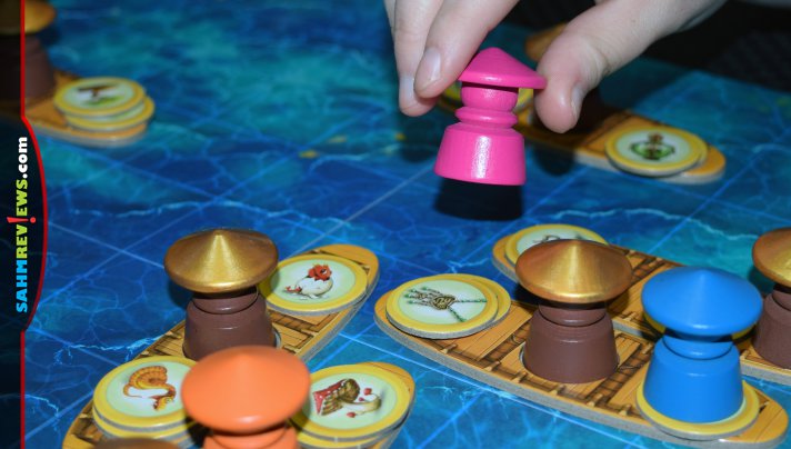 Combine luck with puzzle skills to jump from boat to boat collecting treasures for the princess in Dragon Market from Blue Orange Games. - SahmReviews.com