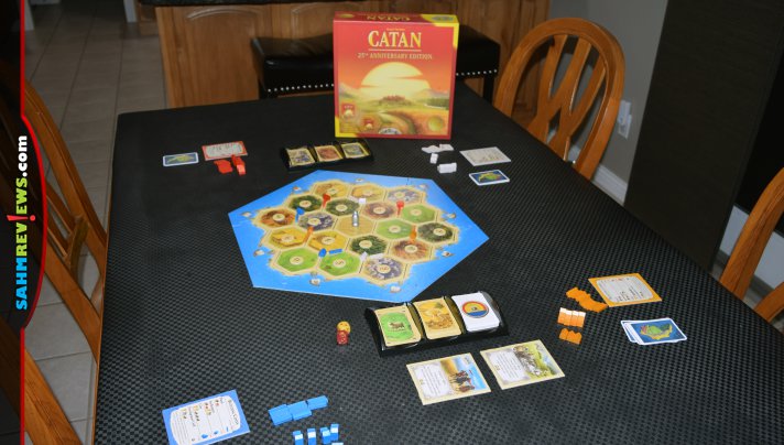 Catan 25th Anniversary Edition from Catan Studio includes custom dice, card sleeves, trays and pieces as well as an expansion for 5-6 players! - SahmReviews.com