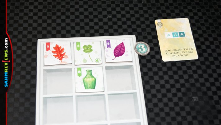 While you technically could hang The Whatnot Cabinet on the wall, this one is a set collection game from Pencil First Games! - SahmReviews.com