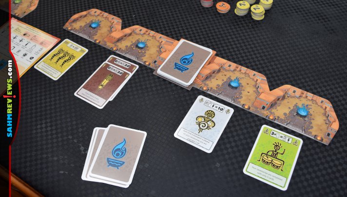 Earn points through completion and ceremonial bonuses by playing cards to open, extend and close ceremonies in Kokopelli from Queen Games. - SahmReviews.com
