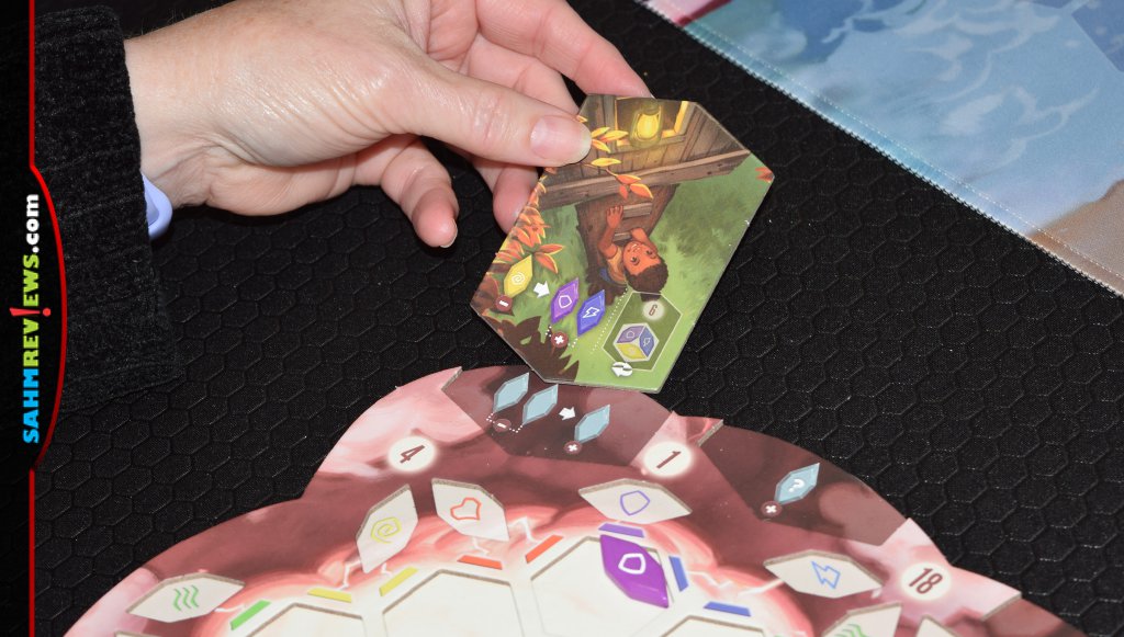 Vivid Memories moment card being placed into slot on side of player board. - SahmReviews.com