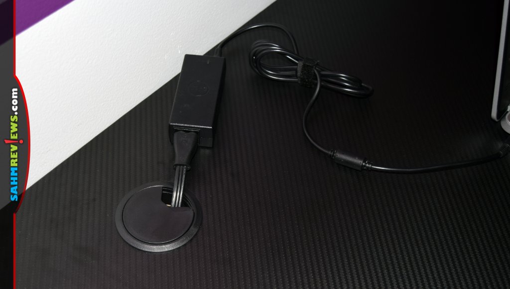 EwinRacing Gaming Desks have grommet holes with rotating caps to control cabling. - SahmReviews.com
