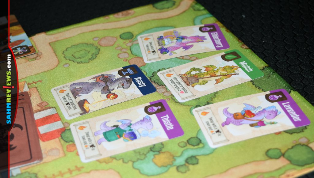 Dragon cards in park portion of game board in Flamecraft from Lucky Duck Games. - SahmReviews.com
