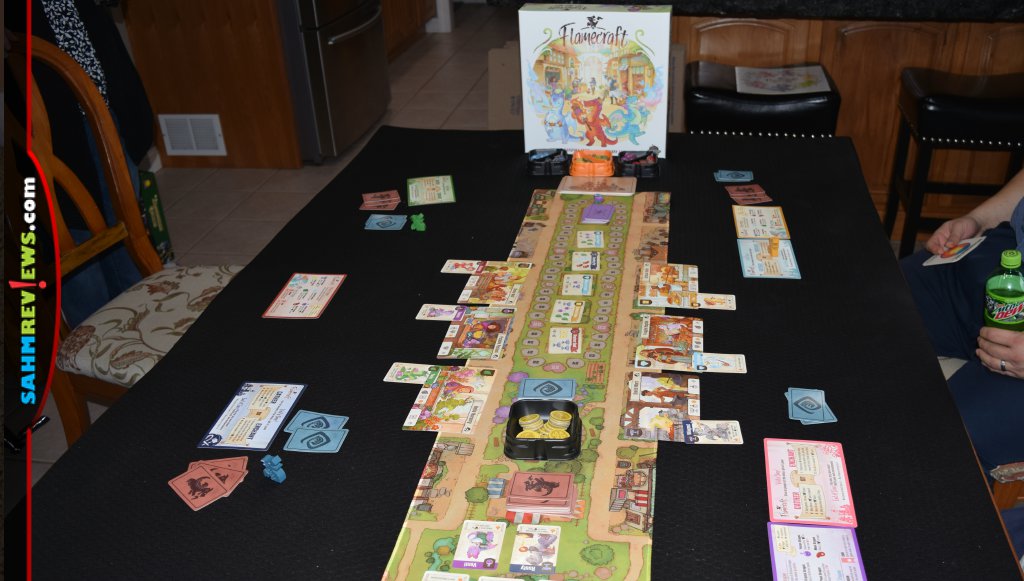 Game setup including board, cards and tokens for Flamecraft by Lucky Duck Games. - SahmReviews.com
