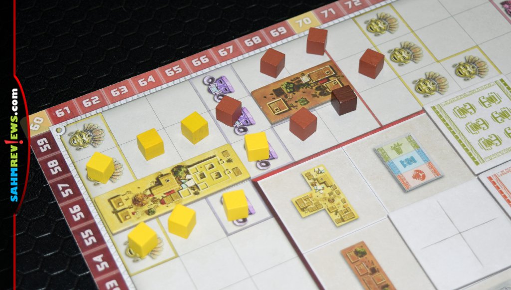 Resource cubes around pieces in Founders of Teotihuacan from Board & Dice. - SahmReviews.com