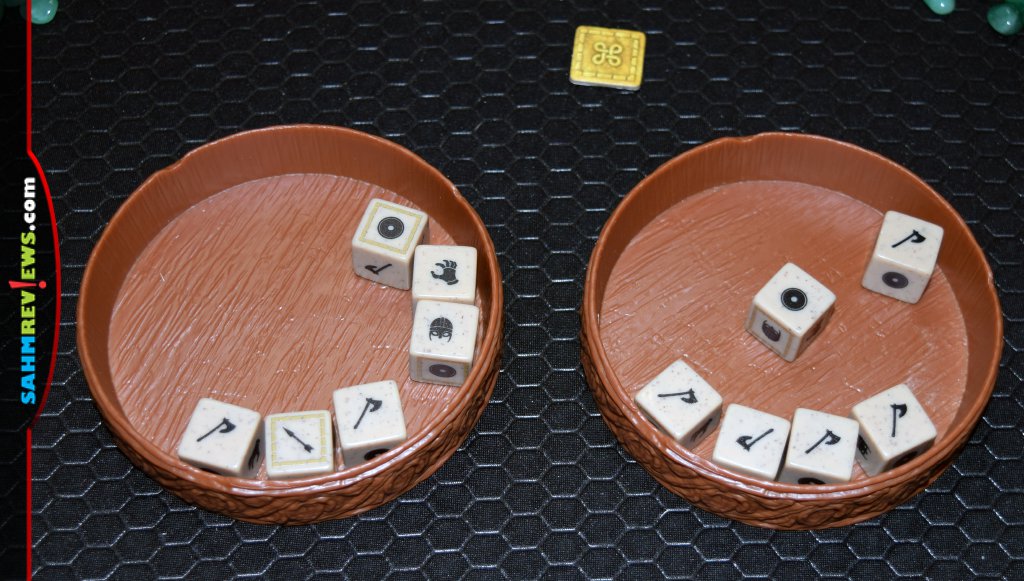 Orlog Dice Game - Two dice trays with the twelve dice ready to be compared to each other.