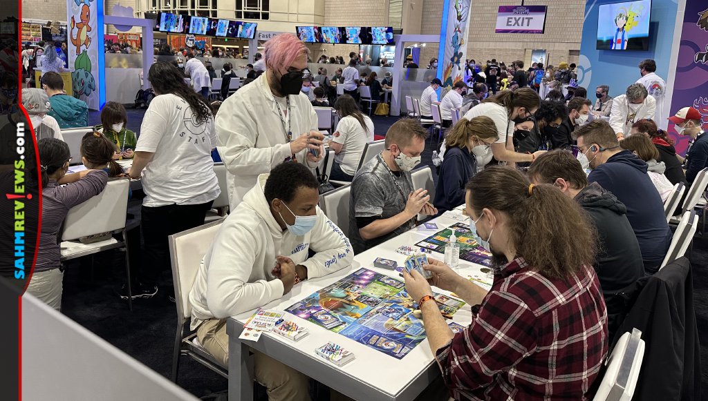 Multiple players simultaneously participating in games of Pokemon at PAX Unplugged. - SahmReviews.com