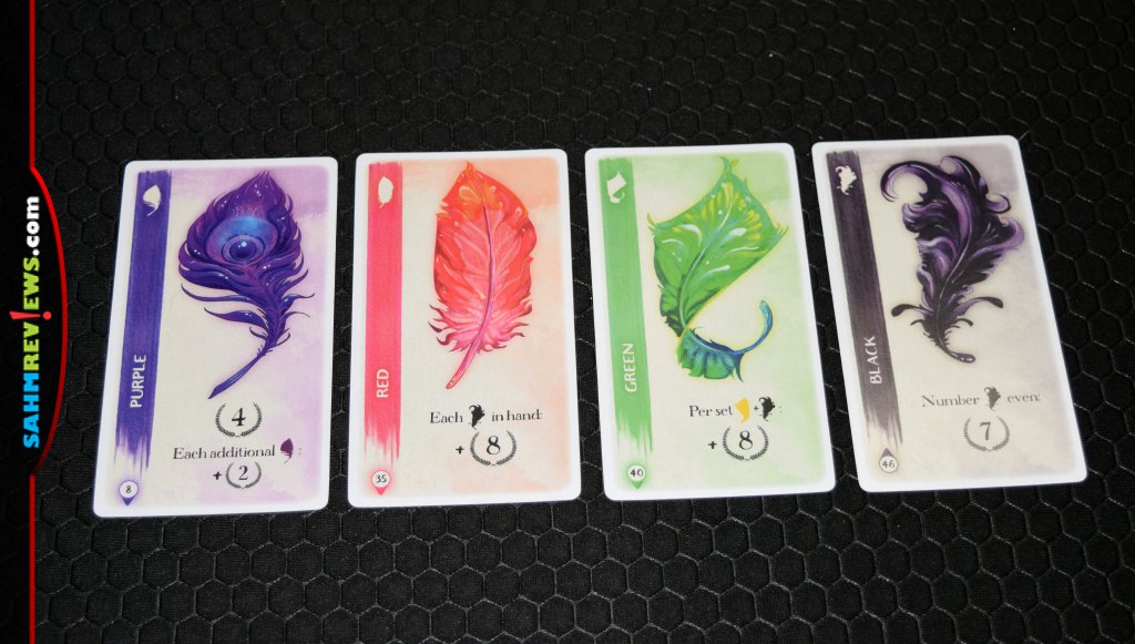 Featherlight Card Game - Four of the different colored feathers and their abilities
