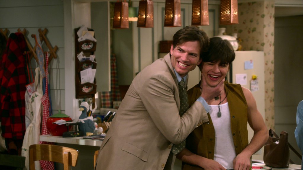 What We're Watching at SahmReviews: That ‘90s Show. (L to R) Ashton Kutcher as Michael Kelso, Mace Coronel as Jay Kelso in episode 101 of That ‘90s Show. Cr. Courtesy of Netflix © 2022