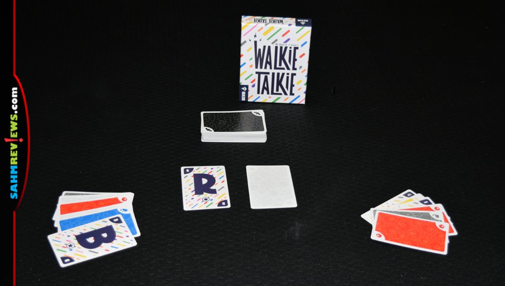 Walkie Talkie card game setup with deck and hands of cards and discard piles. - SahmReviews.com
