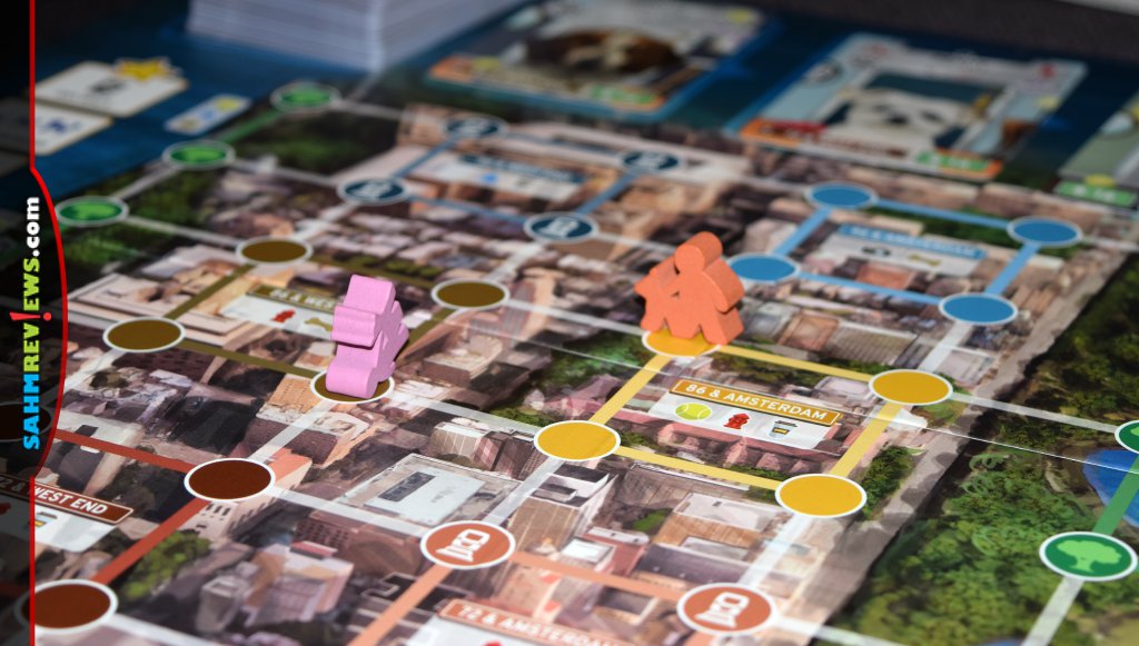 Players move about the city walking dogs in Bark Avenue board game - SahmReviews.com