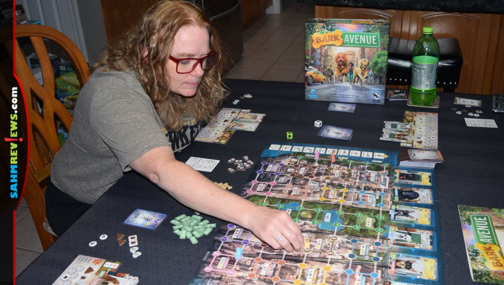 Players take on the assignment of dog walker in Bark Avenue board game