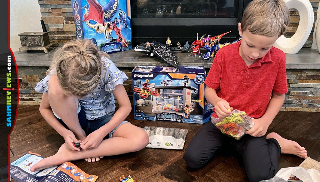 Siblings assembling Playmobil Dragons: The Nine Realms playsets. - SahmReviews.com