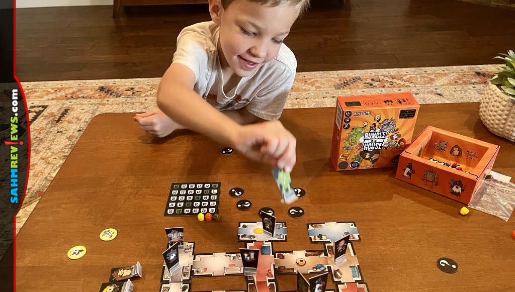 Boy taking action to move a character in Rumble in the House battle game - SahmReviews.com
