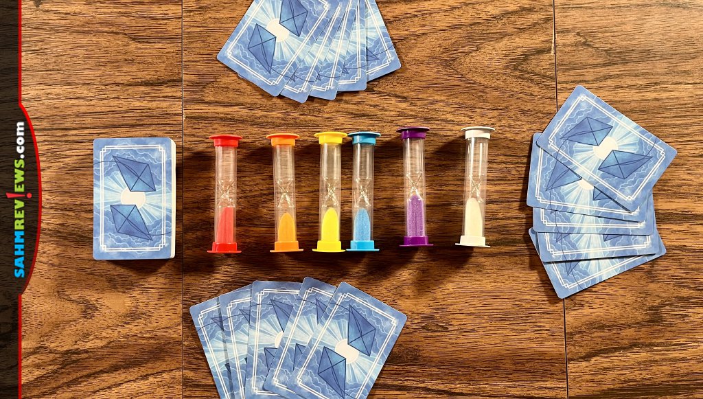 Game components for Kites from Floodgate Games includes six colored sand timers and cards - SahmReviews.com