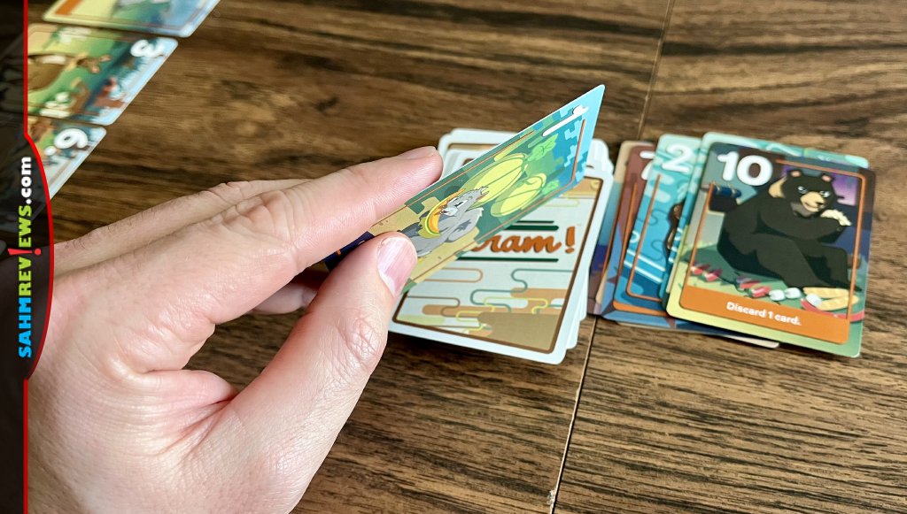 Drawing cards from the deck in Scram card game - SahmReviews.com